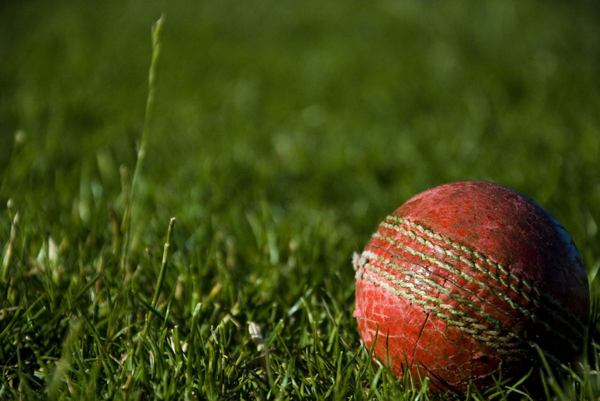 shallow focus photography of red cricket ball — illustrative stock photo