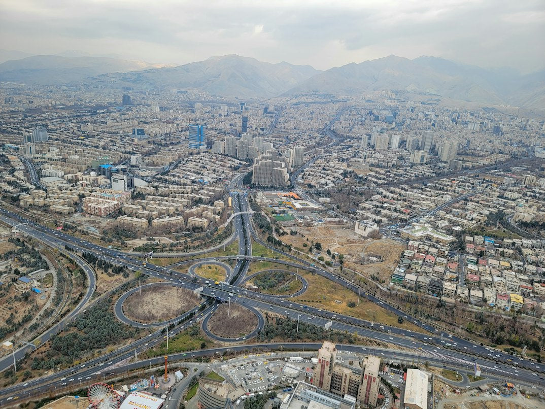 Aerial view of Tehran, Iran, with roads and mountains — illustrative stock photo
